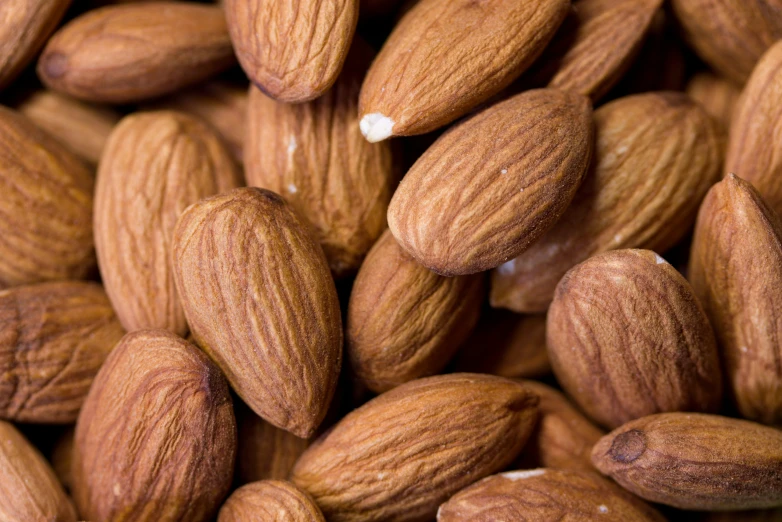 closeup view of almonds on table top