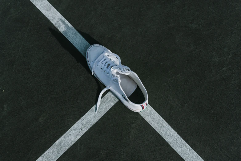 a tennis shoe is sitting on the court