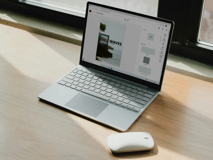 an open laptop computer sitting on top of a wooden desk