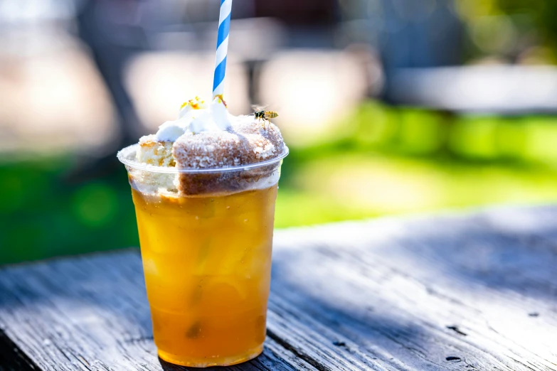 there is an iced drink with a straw on the table