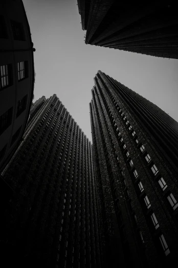 tall buildings with windows in a dark city