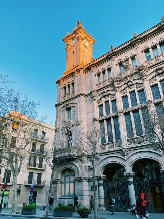 a large building that has a clock on the front