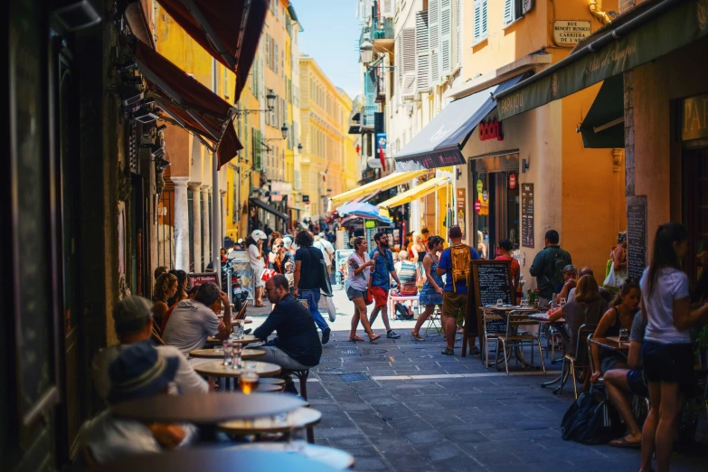 a group of people that are walking down a street