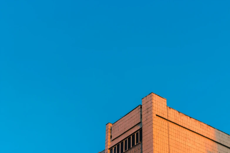 a plane flying through the blue sky on a clear day