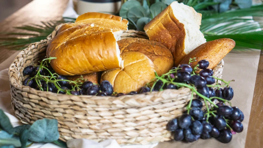 a basket filled with croissants, bread and gs