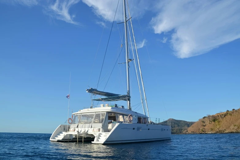 a sailboat is anchored in the ocean