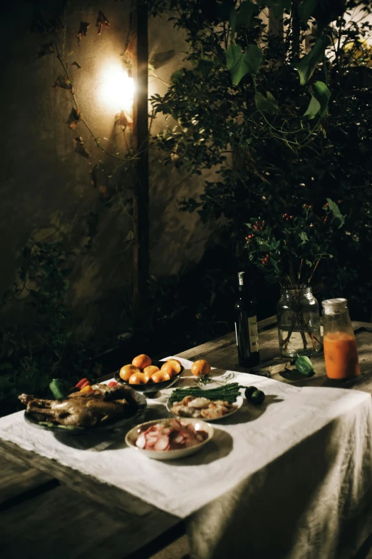 some food and drink are on a table outdoors