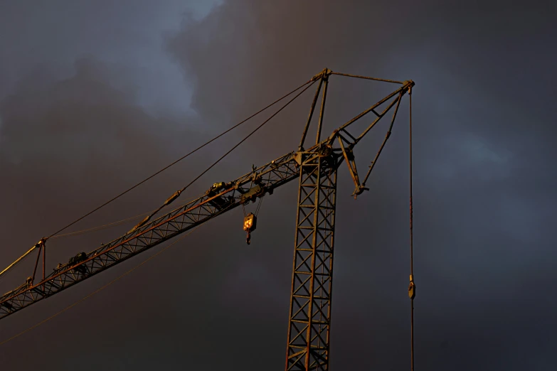 a very large crane that is on top of a tower