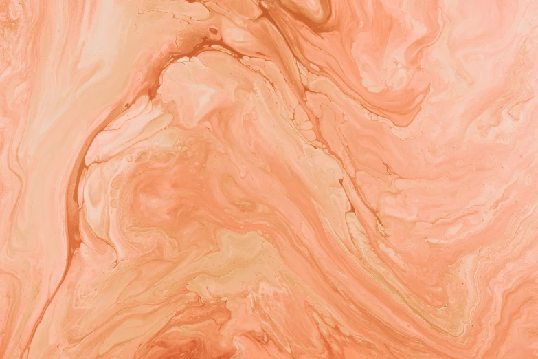 a wood surface with an orange paint pattern