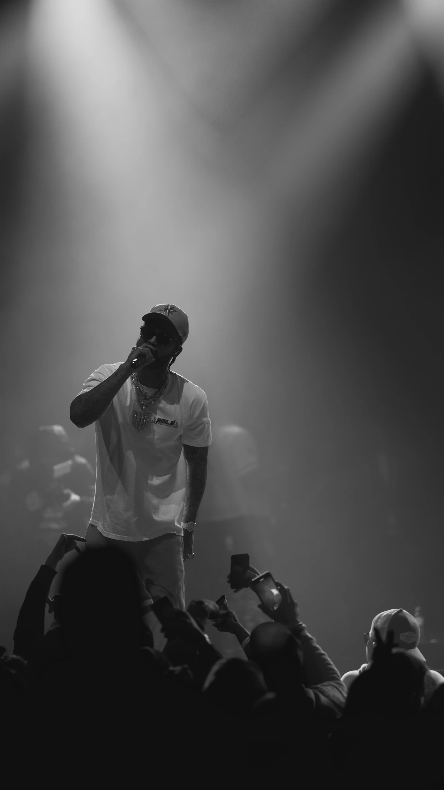 a man that is standing on stage with a microphone