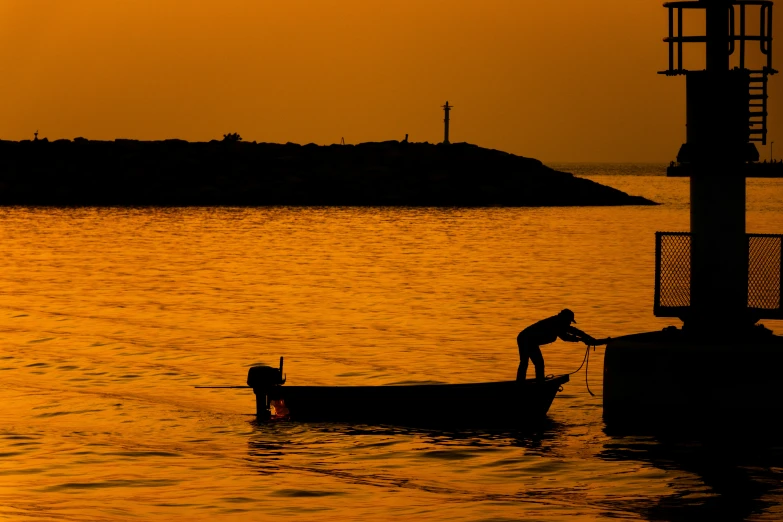 a person hing their boat out into the water