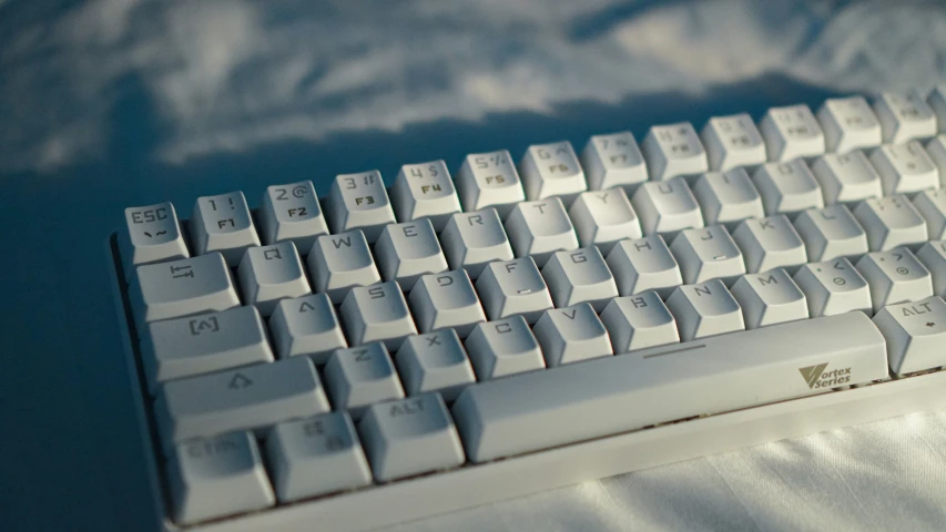 a keyboard sits on the ground in the sun