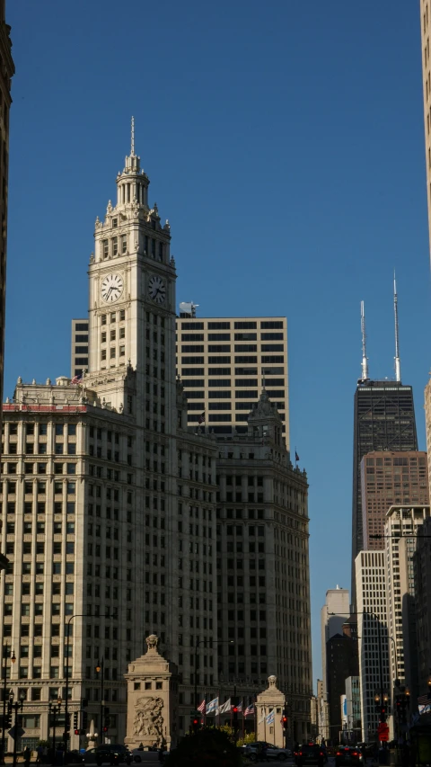 a very large building towering above other city buildings