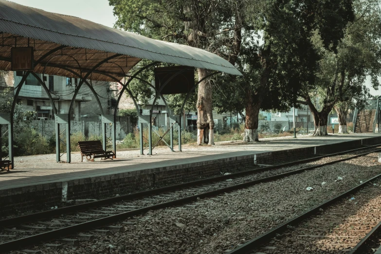 a train is coming down the track while people watch