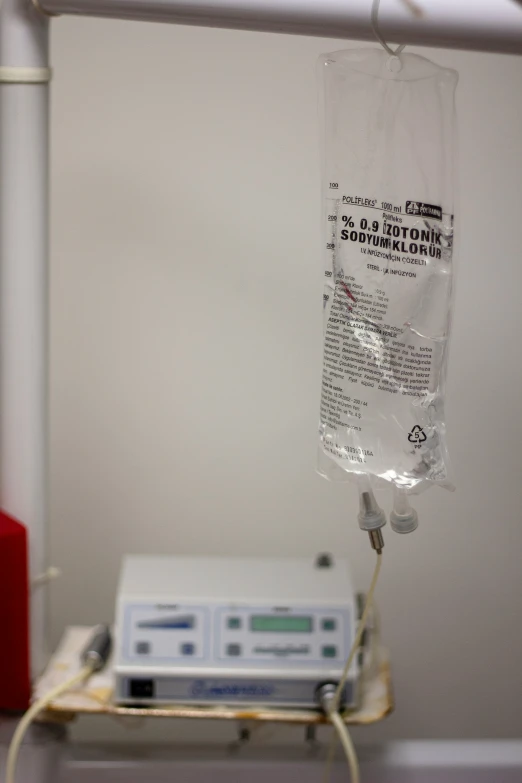 an iv drip being loaded in to a hospital machine