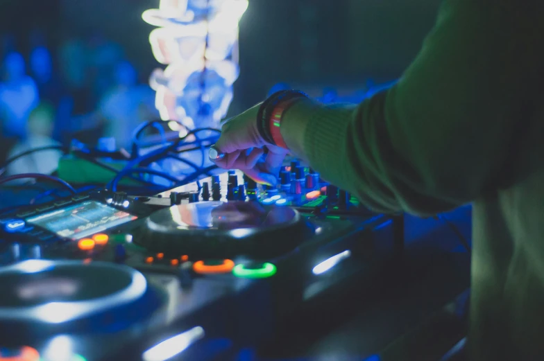 dj spins an item with sound equipment on a mixer