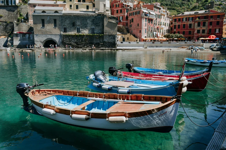 boats docked at a bay in an old town