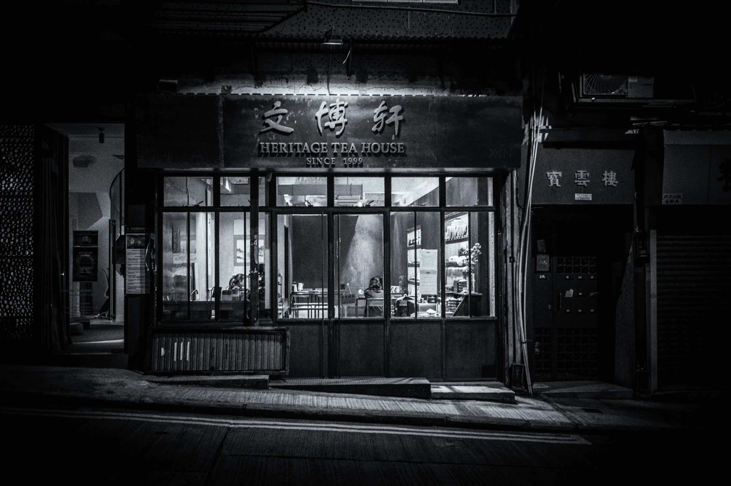 an old, dark store front on a street