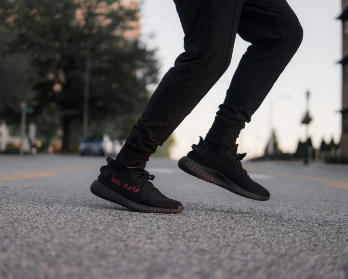 a man standing on the side walk on his shoes