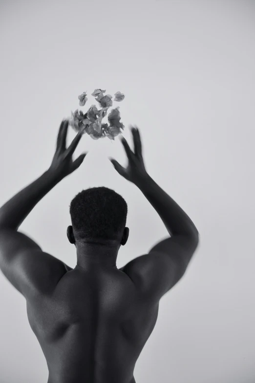 a man is doing yoga with his hands up