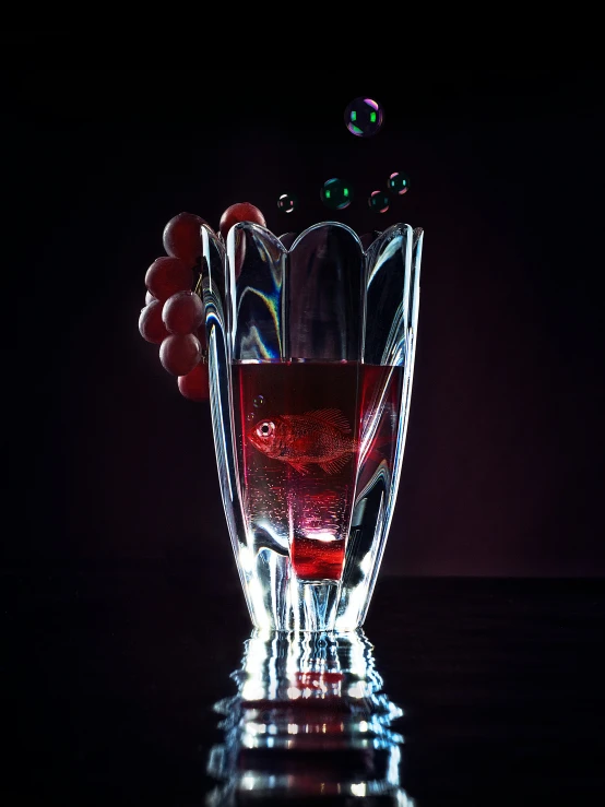 a black and red glass filled with liquid