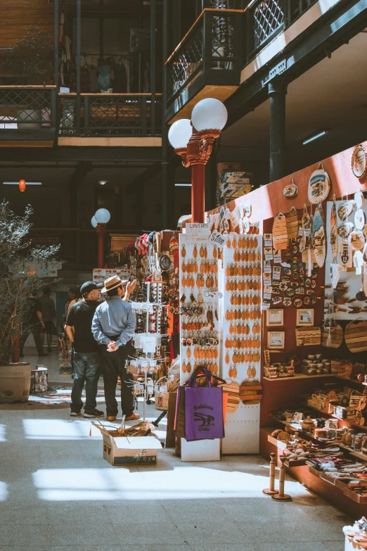 a group of people standing near various boxes of food