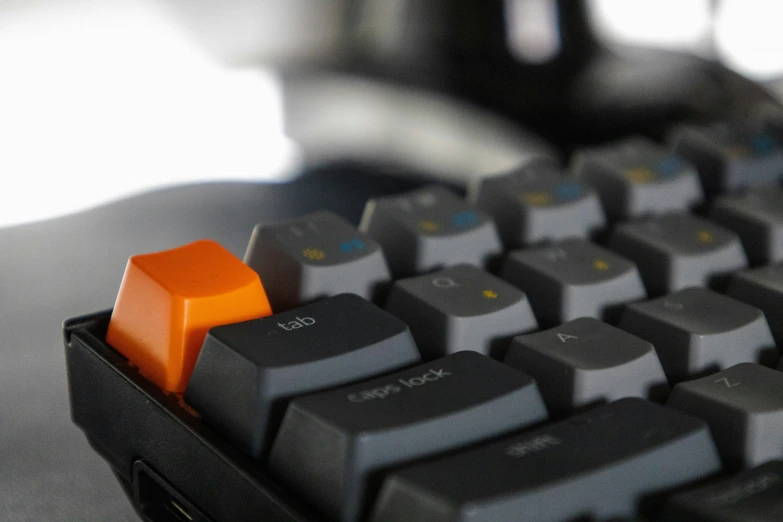 the orange key is located on the black keyboard