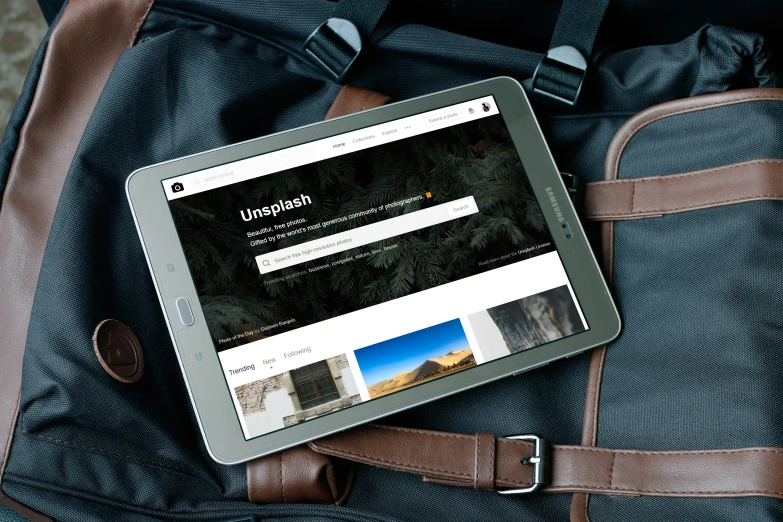 a tablet that is sitting on a backpack