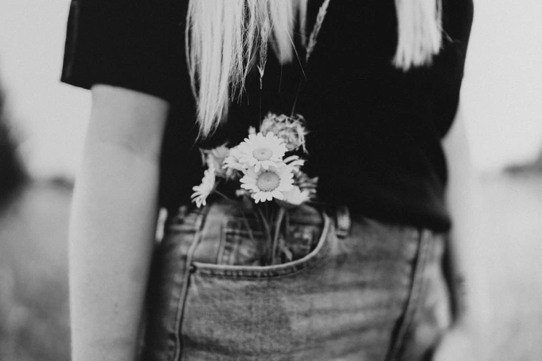 black and white pograph of a girl with long blonde hair wearing an adorable flower pin