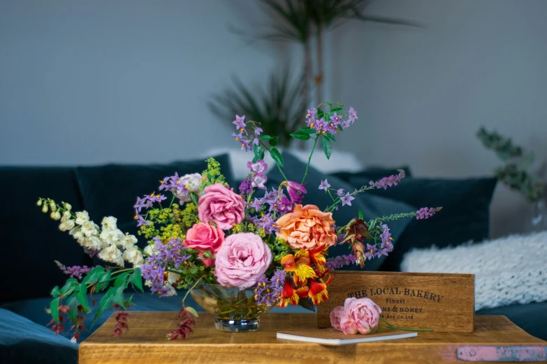 a bouquet of colorful flowers are placed on a table