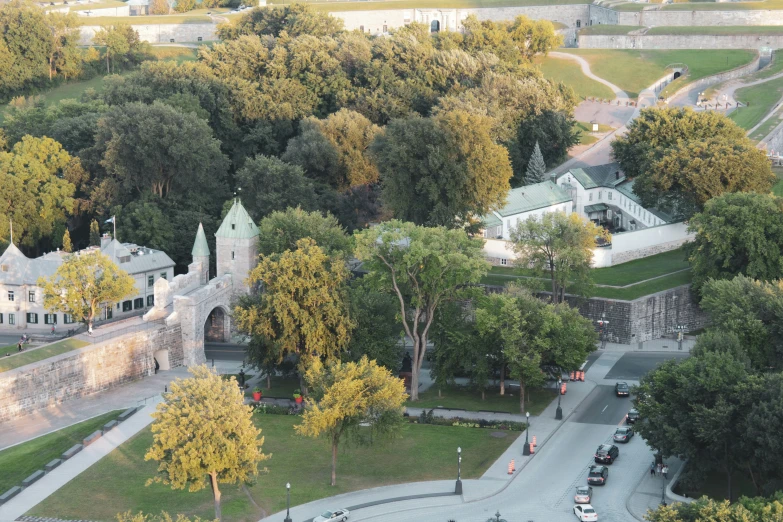 an aerial view of the palace surrounded by trees