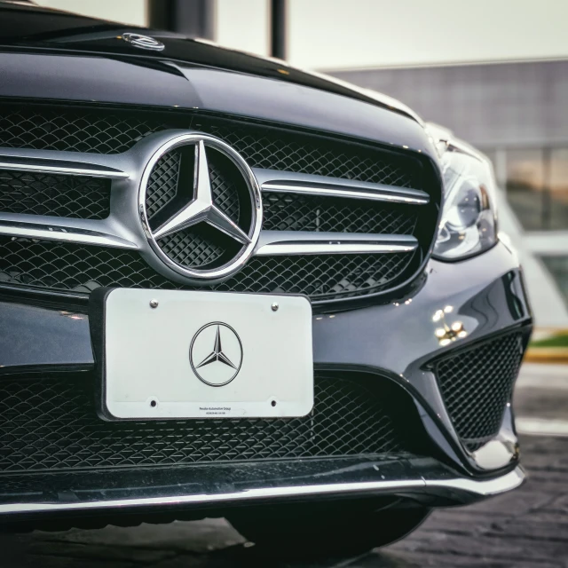 the mercedes logo on the grille of a vehicle