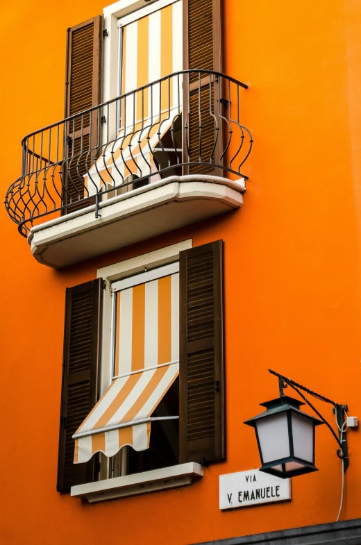 an orange building has white and orange stripes