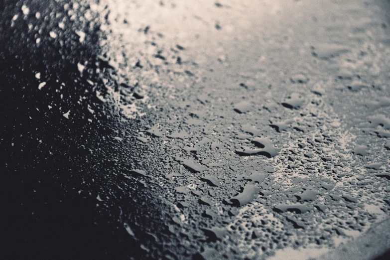 the drops of water on a black surface