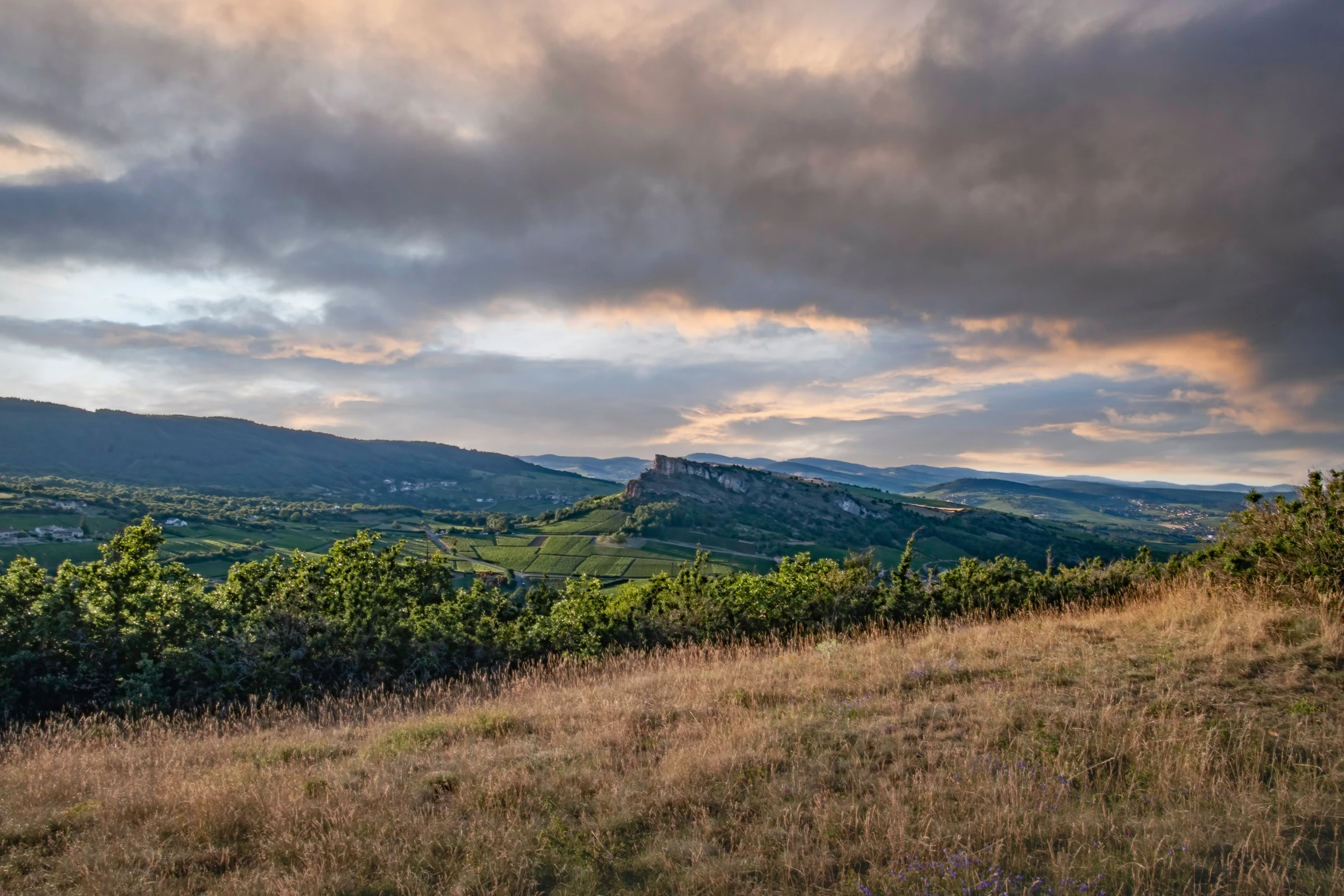 a beautiful view of mountains from a hill