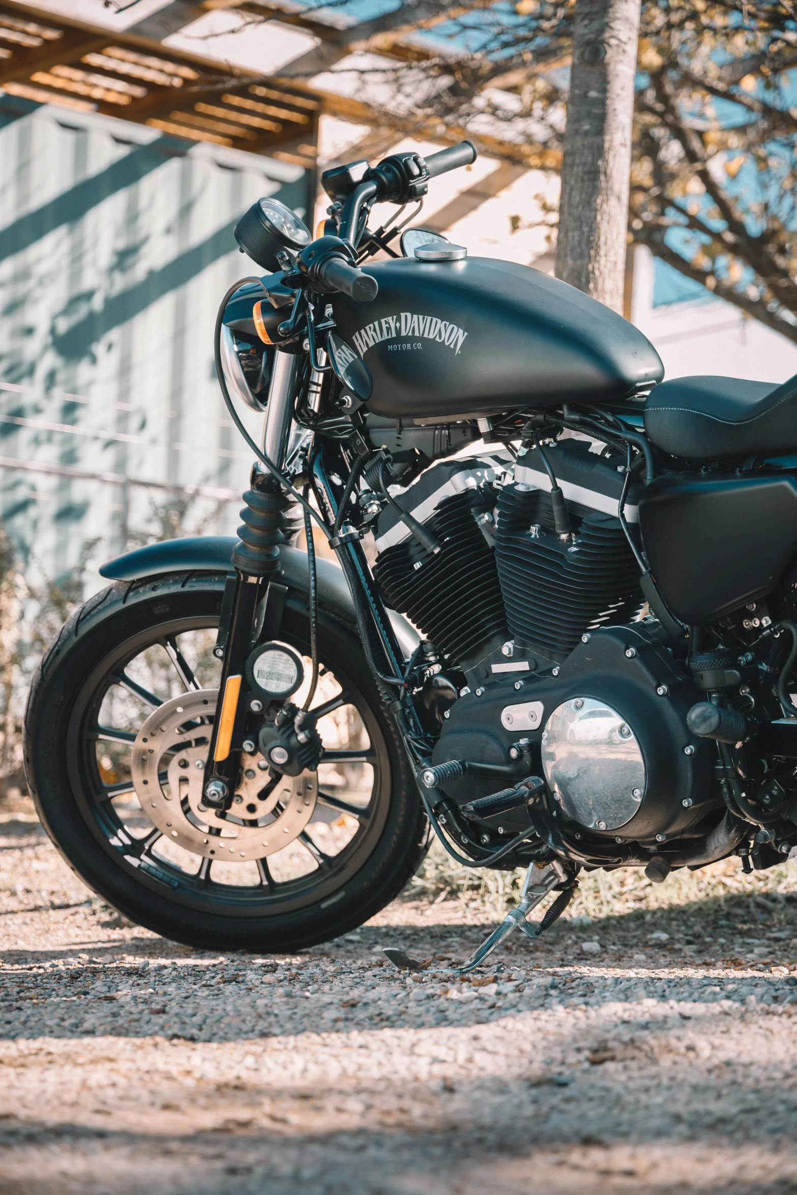 a black motorcycle parked outside of a building