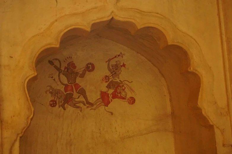 the mural of men on horseback in the fort