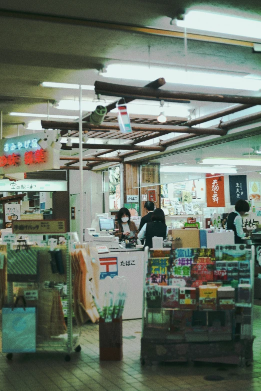 a po with people standing inside of a store