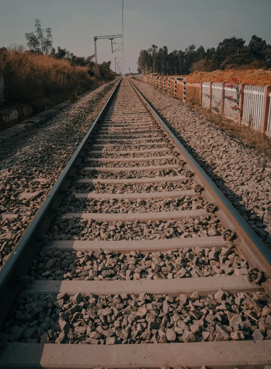 a train track is shown with one long section of tracks going down it