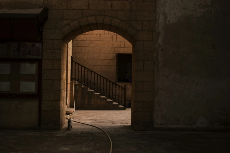 a staircase leading to another entrance in a building