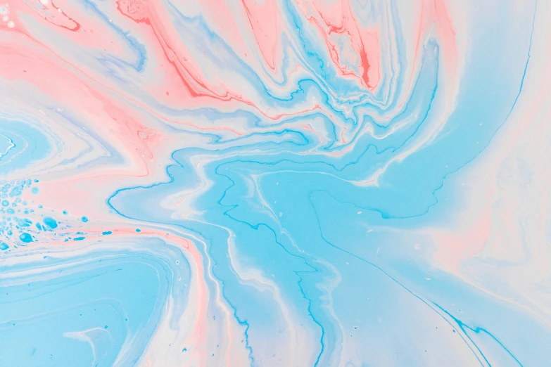 an artistic po of liquid paint that is pink, blue and white