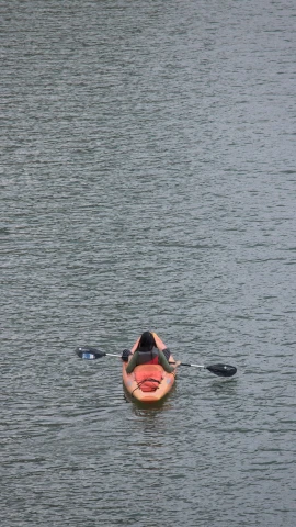 an person in an inflatable boat floating in the water