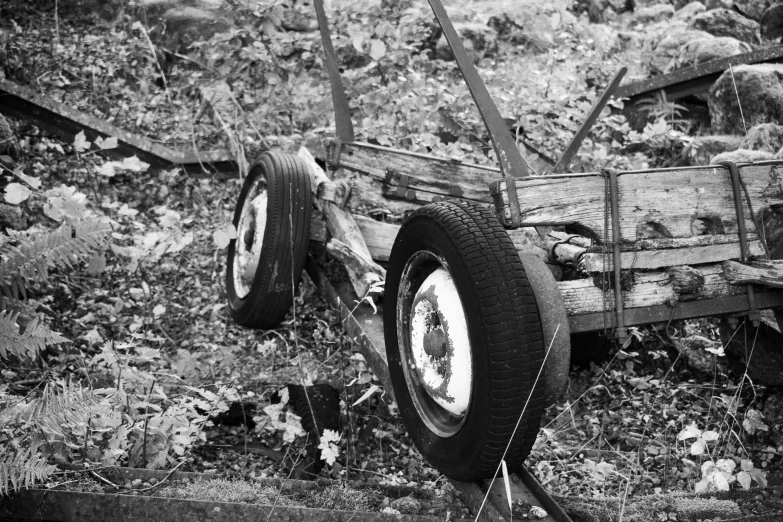 an old car sitting out in a field