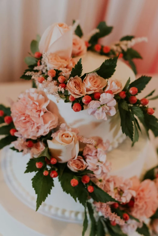 the wedding cake has many flowers on it