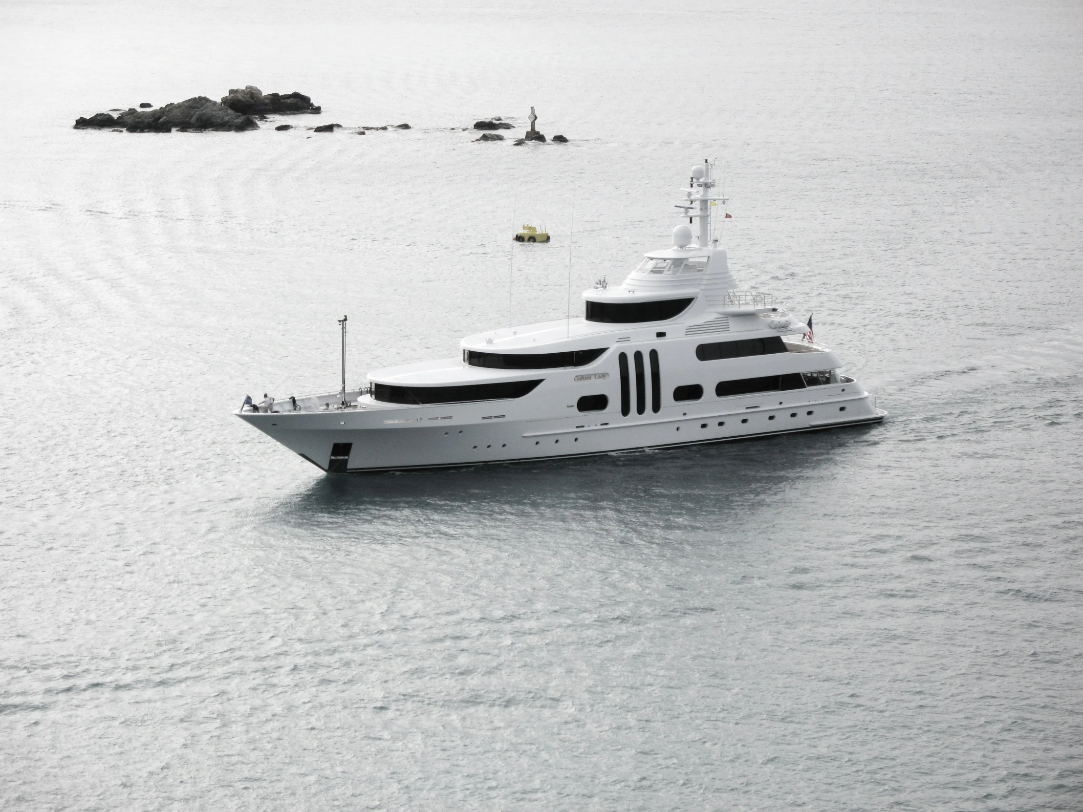 a boat floating on top of the ocean