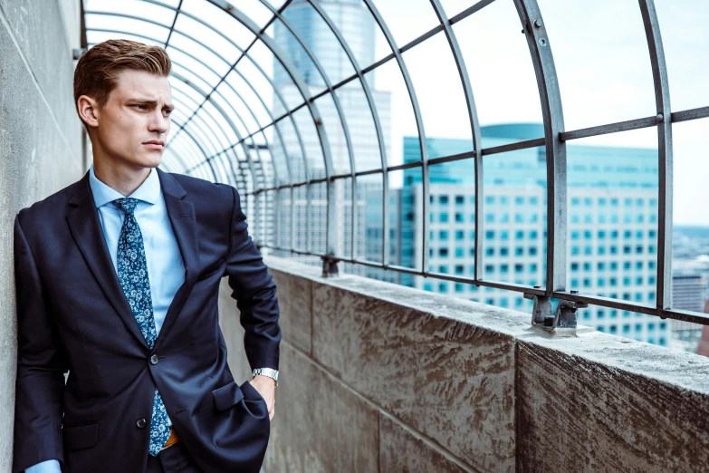 young man dressed up on a skyscr wall