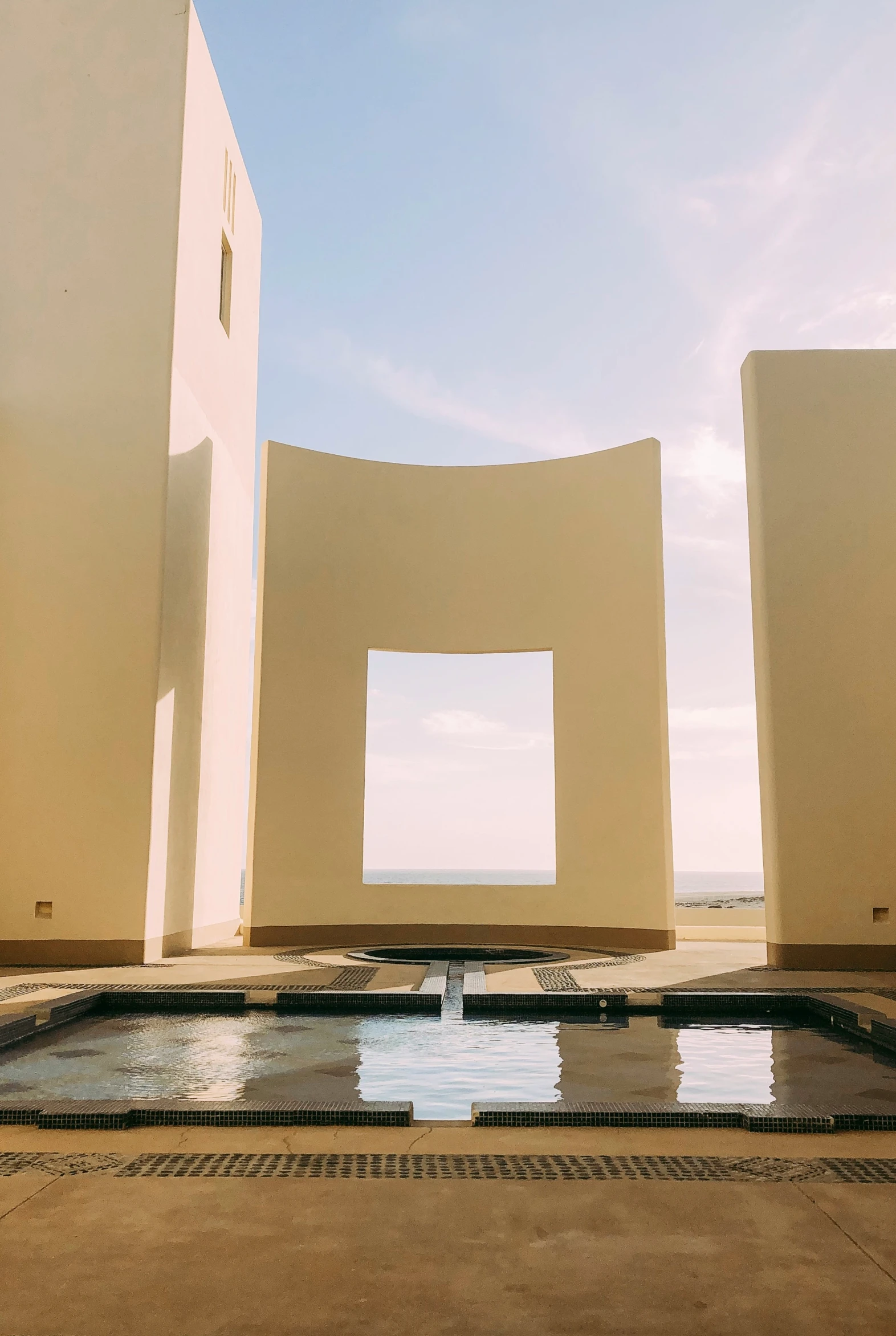 a wall and water with some white blocks in it