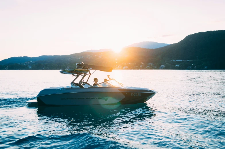 two people on a motorboat out in the water