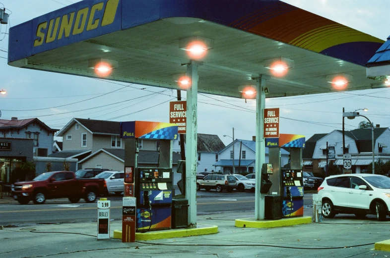 cars are parked at the service station