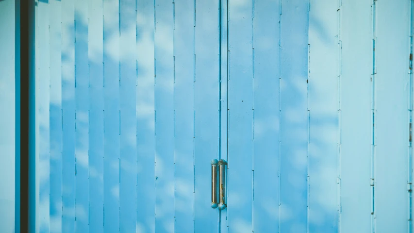 a blue door has the handle on it